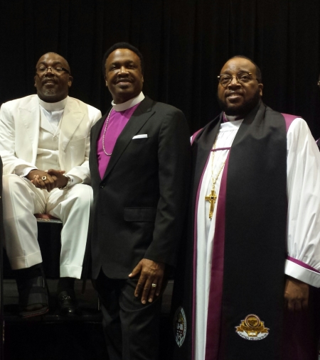 Bishop Neil Ellis (L), presiding prelate of Global United Fellowship; Bishop Kenneth Ulmer; Bishop Marvin L. Sapp (R), stands during his consecration service in Jacksonville, Florida, to become bishop over the Central Province of Global United Fellowship on July 10, 2015.