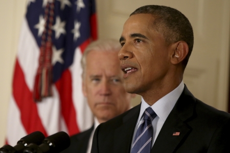 U.S. President Barack Obama delivers a statement with Vice President Joe Biden at his side about the nuclear deal reached between Iran and six major world powers during an early morning address to the nation from the East Room of the White House in Washington, July 14, 2015.