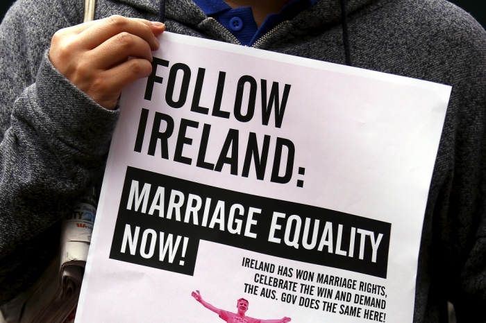 A gay rights activist holds a placard during a rally supporting same-sex marriage, in Sydney, Australia, May 31, 2015. Bill Shorten, leader of Australia's opposition Labour Party introduced a bill to legalise same-sex marriage on June 1, 2015, adding the backing of a major party to growing public support for the issue after last month's landmark 'yes' vote in Ireland. Shorten introduced the bill, the first by a leader of a major Australian political party, in the government-dominated lower house of parliament despite opposition from conservative Prime Minister Tony Abbott, who is not expected to allow it to come up for a vote.