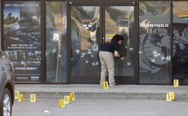 FBI agents work the scene at the Armed Forces Career Center in Chattanooga, Tennessee, July 16, 2015. Four Marines were killed on Thursday by a gunman who opened fire at two military offices in Chattanooga, Tennessee, before being fatally shot in an attack officials called a brazen, brutal act of domestic terrorism.