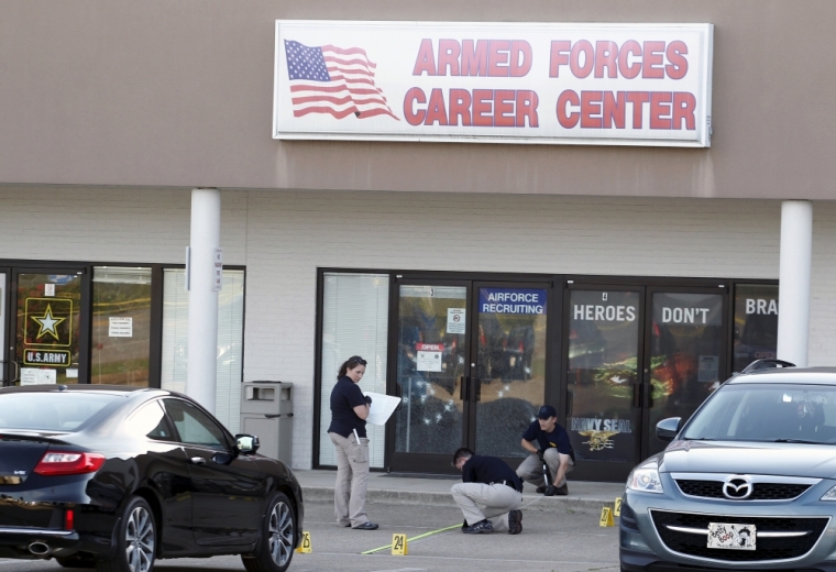 FBI agents work the scene at the Armed Forces Career Center in Chattanooga, Tennessee, July 16, 2015. Four Marines were killed on Thursday by a gunman who opened fire at two military offices in Chattanooga, Tennessee, before being fatally shot in an attack officials called a brazen, brutal act of domestic terrorism.