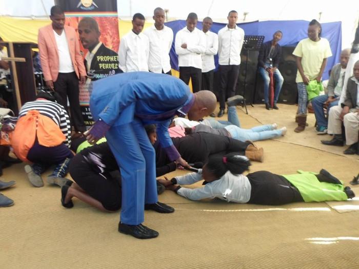 South African prophet Penuel Mnguni, 24, commanding 'snake spirits' into his congregants.