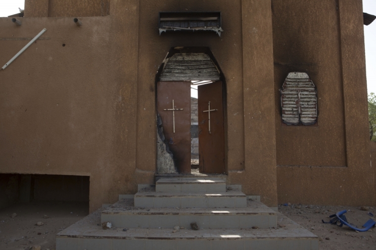 The burnt entrance of an evangelical church that was destroyed in riots demonstrating against French satirical magazine Charlie Hebdo's cartoons of the Islamic prophet Muhammad, is pictured in Niamey, Niger, January 23, 2015. At least five people were killed last Saturday in protests in Niger against Charlie Hebdo's cartoons of the Prophet Mohammad, authorities said, bringing the death toll from two days of violence in the country to 10.