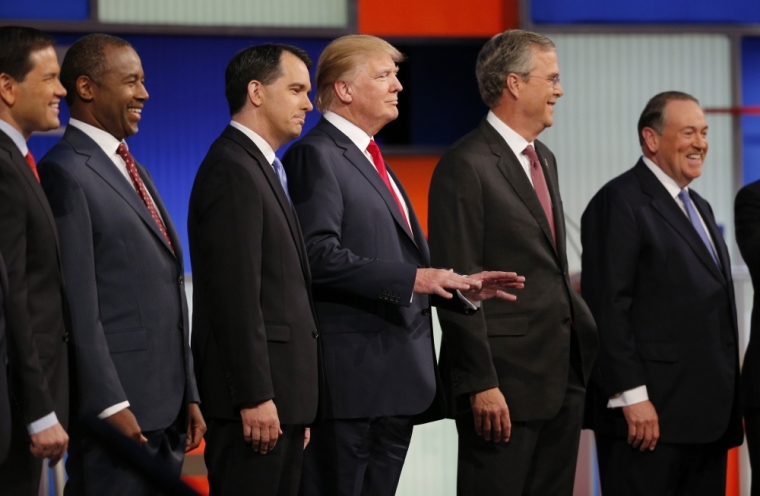 Republican 2016 presidential candidates (L-R), U.S. Senator Marco Rubio, Dr. Ben Carson, Wisconsin Governor Scott Walker, businessman Donald Trump, former Florida Governor Jeb Bush and former Arkansas Governor Mike Huckabee, pose together at the start of the first official Republican presidential candidates debate of the 2016 U.S. presidential campaign in Cleveland, Ohio, August 6, 2015.