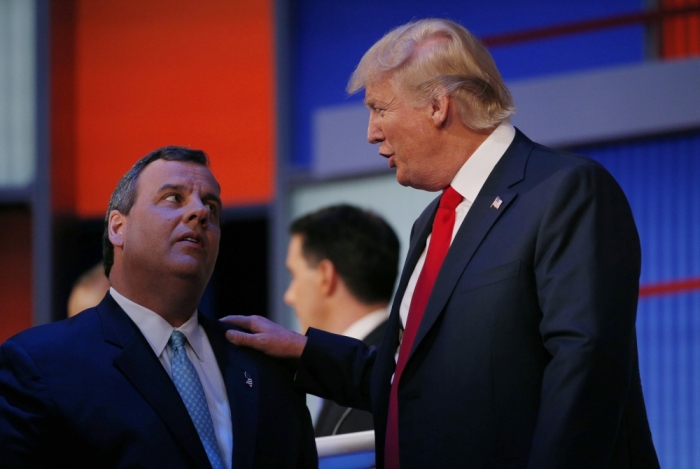 Republican 2016 U.S. presidential candidate New Jersey Governor Chris Christie (L) talks to fellow candidate businessman Donald Trump during a commercial break in the midst of the first official Republican presidential candidates debate of the 2016 U.S. presidential campaign in Cleveland, Ohio, August 6, 2015.