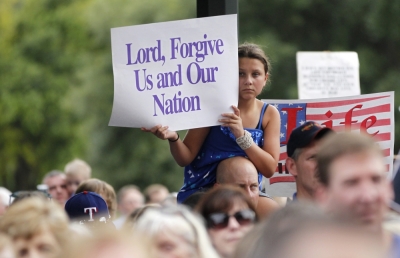 A girl holds a sign during an anti-abortion rally at the State Capitol in Austin, Texas, July 8, 2013. The political battle in Texas over proposed restrictions on abortion resumes on Monday with a rally by abortion opponents and a public hearing in the state Senate, where Democrat Wendy Davis staged a filibuster last month to stall the Republican-backed measure.