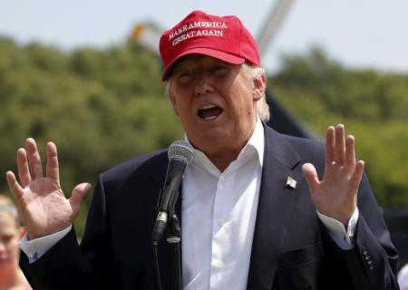 Donald Trump talks to the media before proceeding to the Iowa State Fair on August 15, 2015.