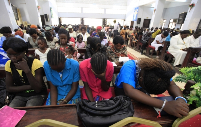 Christians pray during Easter Sunday service at Episcopal Church of the Sudan Diocese of Khartoum All Saints Cathedral in Khartoum, April 24, 2011.