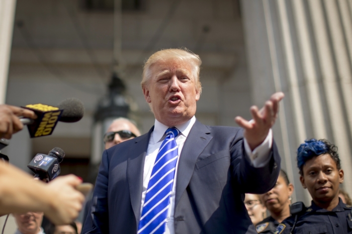 U.S. Republican presidential candidate Donald Trump exits the Manhattan Supreme Courthouse following service of jury duty in New York August 17, 2015. The real estate mogul's service came after a state judge in March fined him 0 for failing to respond to summonses to serve jury duty five times since 2006.