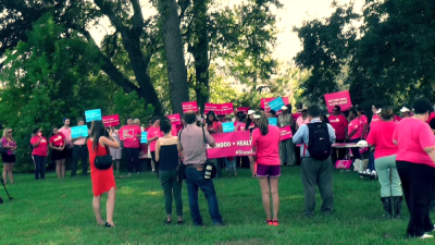 Planned Parenthood supporters protest actions by Louisiana Gov. Bobby Jindal outside the governor's mansion, August 21, 2015.