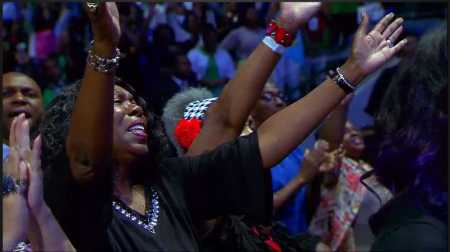 People praising and worshipping at MegaFest at American Airlines Center in Dallas, Texas on August 23, 2015.