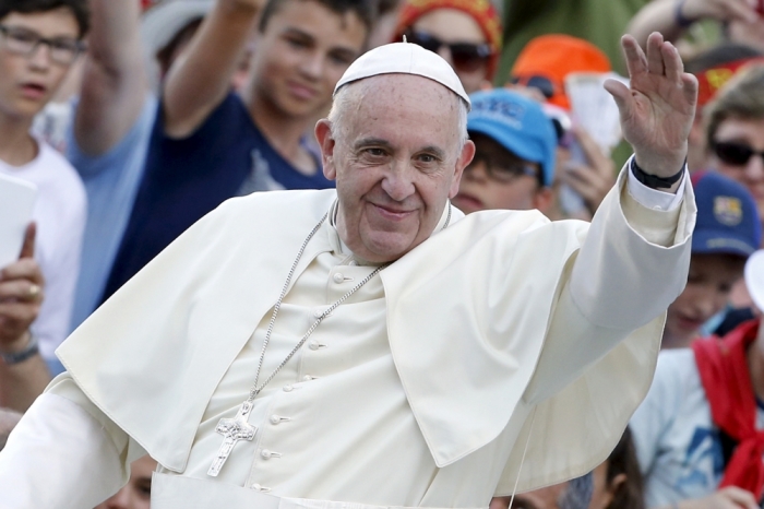 Pope Francis waves as he arrives to attend an audience for altar servers at St. Peter's Square in Vatican City August 4, 2015.