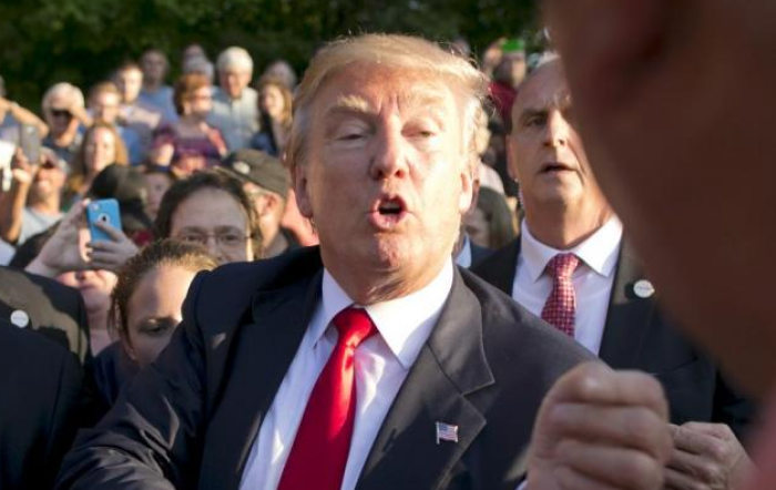 Republican Party front-runner Donald Trump greets his supporters on July 16, 2015 after a speaking campaign