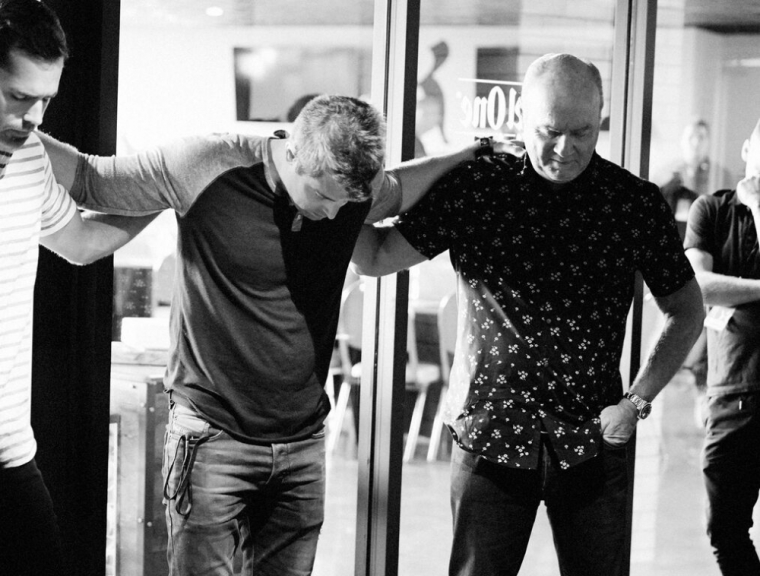 Greg Laurie prays on the last day of the Harvest Crusade Anaheim on Sunday, August 30, 2015. Organizers say that 32,000 people attended in the Angel Stadium in Anaheim, California, and 3,488 people made decisions for Christ.