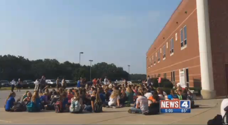 Students stage a walkout protest at Hillsboro High School in Hillsboro, Missouri, on August 31, 2015, over a transgender student's request to use the girls' locker room.