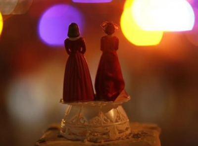 Two bride figurines are displayed at a rally in Hollywood, California, May 26, 2009