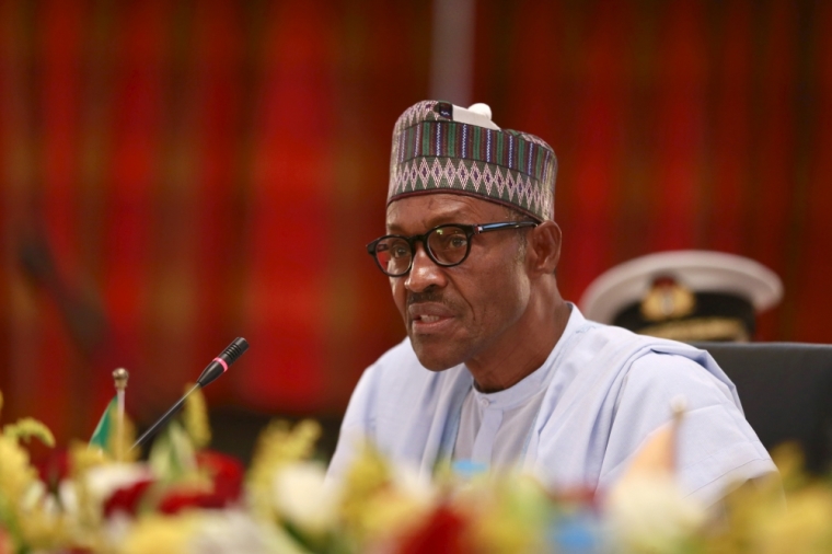 Nigeria's President Muhammadu Buhari speaks during the opening ceremony for the Summit of Heads of State and Governments of the Lake Chad Basin Commission (LCBC) at the presidential wing of the Nnamdi Azikiwe International Airport Abuja, Nigeria June 11, 2015. New Nigerian President Muhammadu Buhari met his regional counterparts in Abuja on Thursday to set up a joint military force against Boko Haram, the latest sign of his intent to crush the Islamist militant group early in his tenure. The 72-year-old former military ruler, who was inaugurated just two weeks ago, welcomed the leaders of neighboring Chad, Niger and Benin for the impromptu one-day summit at Abuja airport. Cameroon sent its defense minister.