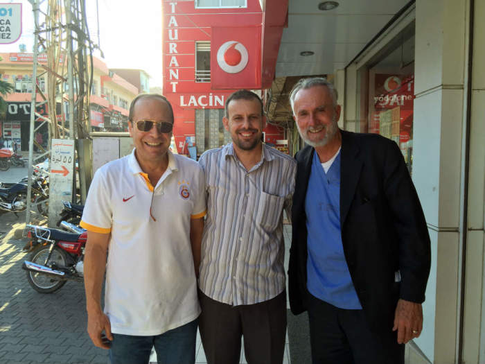 New York City pastor William Devin is seen with new friends in the Syrian border town of Reyhanli, Turkey. Devlin has been volunteering at a clinic aiding refugees fleeing war-torn Syria.