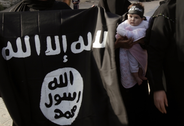 Palestinians take part in a protest calling for the release of what they say are jailed Salafist relatives from Hamas prisons, in Rafah in the southern Gaza Strip April 6, 2013. The flag reads, 'There is no God but Allah, Mohammed is the messenger of Allah.'