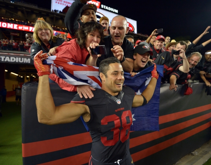 San Francisco 49ers running back Jarryd Hayne (38) poses with an Australian flag after the game against the Minnesota Vikings at Levi's Stadium, Santa Clara, California, September 14, 2015.