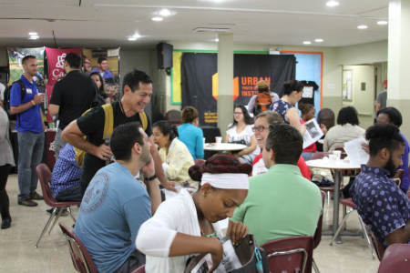 Dr. Larry Acosta, founder/chief executive officer of the Hispanic Ministry Center, Urban Youth Workers Institute, is seen with attendees of his organization's RELOAD event at Bay Ridge Christian Center in Brooklyn, New York, in this September 12, 2015, photo.