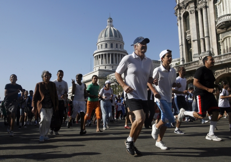 Participants run in the 12th Terry Fox Marathon of Hope in Havana, Cuba, March 20, 2010. The marathon is held annually to raise funds for cancer research and to honor Canadian Terry Fox, who was diagnosed with cancer at the age of 18 in 1977. With his right leg partially amputated, Fox started to run a marathon every day across Canada, completing 5,373 km (3,339 miles), until he was forced to stop as the cancer had spread to his lungs. Fox died at the age of 22.