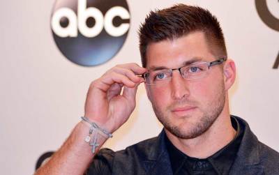 Tim Tebow arrives at the 48th Country Music Association Awards in Nashville, Tennessee, November 5, 2014.