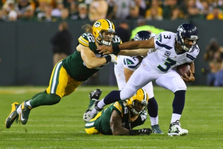 Seattle Seahawks quarterback Russell Wilson (3) is tackled by Green Bay Packers inside linebacker Clay Matthews (52) during the first quarter at Lambeau Field, Green Bay, Wisconsin, September 20, 2015.