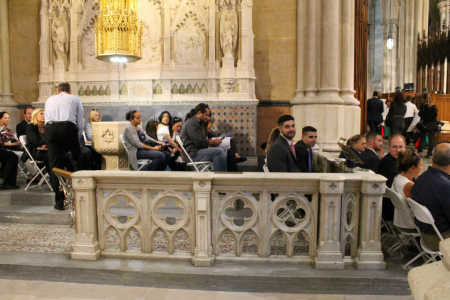 Brothers Brian and Daniel Letts are seen on the far right among worshippers seated near the altar at St. Patrick's Cathedral in New York City where Pope Francis led Evening Prayer on September 24, 2015.