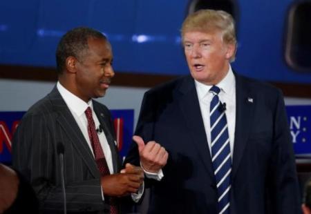 Dr. Ben Carson and businessman Donald Trump talk.