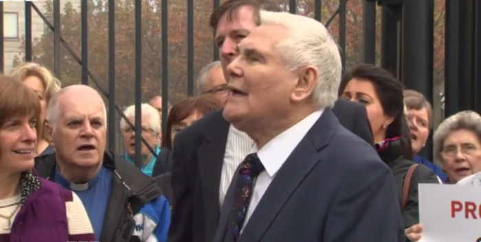 British Pastor James McConnell is joined by supporters at Belfast magistrate after his trial was set for his comments about Islam.