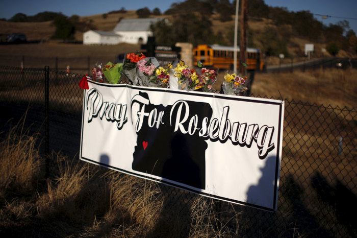 Memorial flowers are seen outside Umpqua Community College in Roseburg, Oregon, United States, October 2, 2015. A gunman stalked onto a college campus in southwestern Oregon on Thursday and opened fire, killing nine people and wounding seven before police shot him to death, authorities said, in yet another burst of U.S. gun violence that ranked as the deadliest this year.