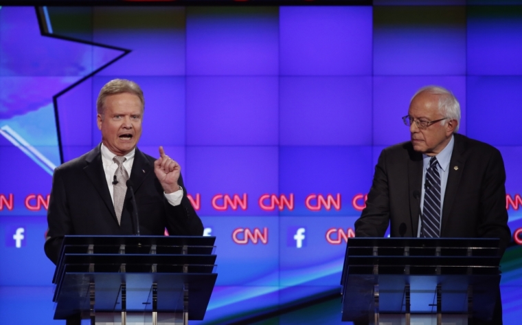 Former U.S. Senator Jim Webb speaks as Senator Bernie Sanders (R) looks on during the first official Democratic candidates debate of the 2016 presidential campaign in Las Vegas, Nevada, October 13, 2015.