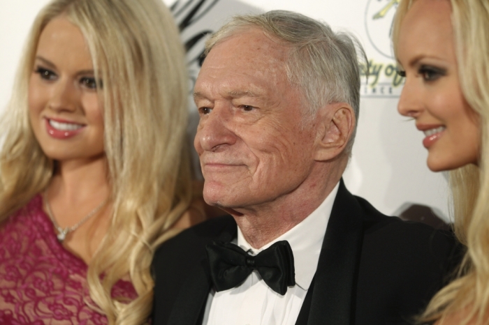 Playboy magazine founder Hugh Hefner and girlfriends Anna Sophia Berglund (L) and Shera Bechard arrive at the Society of Singers annual dinner in Beverly Hills, California September 19, 2011.