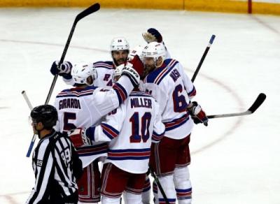 The New York Rangers celebrate scoring a goal.