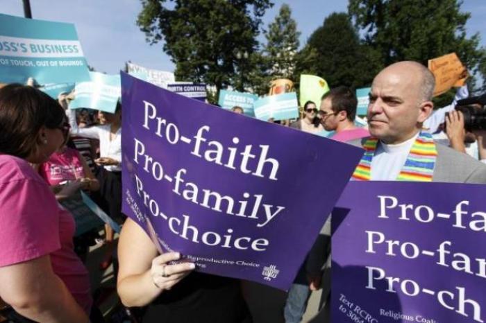 Pro-choice demonstrators rally outside the U.S. Supreme Court in Washington June 30, 2014.