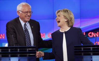 Democratic presidential candidate and former Secretary of State Hillary Clinton shakes hands with rival candidate and Senator Bernie Sanders (L) and thanks him for saying that he and the American people are sick of hearing about her State Department email controversy and want to hear about issues that effect their lives, as they participate in the first official Democratic candidates debate of the 2016 presidential campaign in Las Vegas, Nevada October 13, 2015.