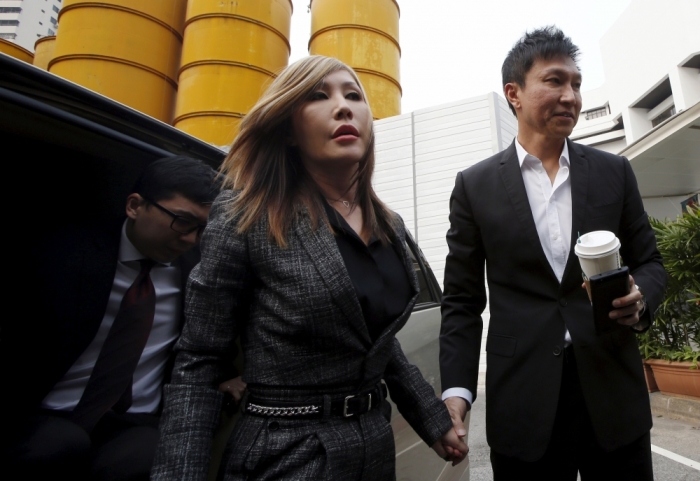 City Harvest Church founder Kong Hee (R) and his wife Sun Ho, also known as Ho Yeow Sun, arrive at the State Courts in Singapore, October 21, 2015, where a verdict is expected to be delivered for their trial of misappropriating S million (.5 million) of church funds and falsifying the church's accounts.