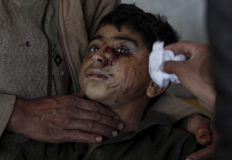 A boy, who was injured during an earthquake, receives first aid at the Lady Reading hospital in Peshawar, Pakistan October 27, 2015. The Taliban urged aid agencies on Tuesday to push ahead in delivering emergency supplies to victims of the massive earthquake that hit remote mountainous regions of northern Afghanistan and Pakistan. With harsh winter weather setting in across the rugged Hindu Kush mountains where the earthquake struck, the plight of thousands of people left homeless by the earthquake was becoming increasingly serious. However the relief effort is being complicated by unstable security caused by the Taliban insurgency, which has made large parts of the affected areas unsafe for international organisations and government troops.