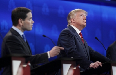 Republican U.S. presidential candidate U.S. Senator Marco Rubio (L) speaks as businessman Donald Trump (R) listens at the 2016 U.S. Republican presidential candidates debate held by CNBC in Boulder, Colorado, October 28, 2015.