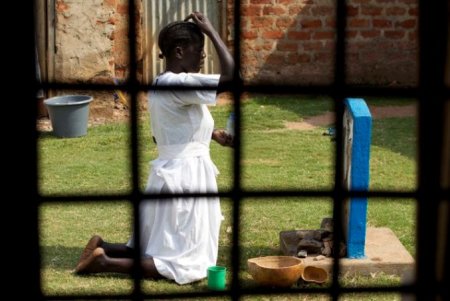 A follower of the Holy Spirit Movement church performs rituals at a shrine in Gulu town, north of Uganda capital Kampala February 15, 2015.