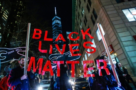 Protesters hoist a sign reading 'black lives matter' as they demonstrate in New York City.