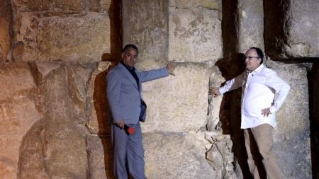 Egyptian Minister of Antiquities Mamdouh el-Damati (L) stands with Jean Claude Barre of the Heritage Innovation Preservation Institute in front of the Great Pyramid of Giza on the outskirts of Cairo, Egypt, Nov. 9, 2015.