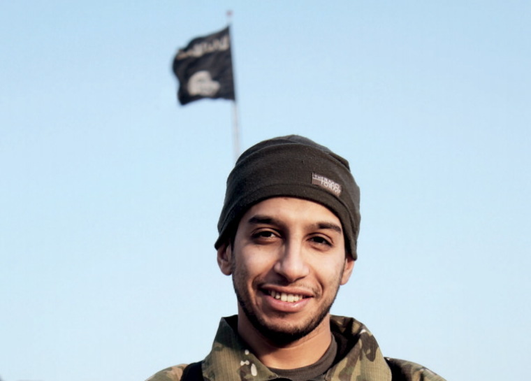 An undated photograph of a man described as Abdelhamid Abaaoud that was published in the Islamic State's online magazine Dabiq and posted on a social media website. A Belgian national currently in Syria and believed to be one of Islamic State's most active operators is suspected of being behind Friday's attacks in Paris, according to a source close to the French investigation. 'He appears to be the brains behind several planned attacks in Europe,' the source told Reuters of Abdelhamid Abaaoud, adding he was investigators' best lead as the person likely behind the killing of at least 129 people in Paris on Friday. According to RTL Radio, Abaaoud is a 27 year old from the Molenbeek suburb of Brussels, home to other members of the militant Islamist cell suspected of having carried out the attacks.