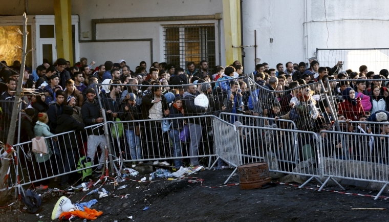 Migrants wait to access Austria at the border near the village of Sentilj, Slovenia, November 18, 2015. Austria announced plans on Friday (November 13) to build a 3.7-km (2.5-mile) fence on either side of its busiest border crossing with Slovenia to help manage the flow of thousands of migrants a day onto its territory.