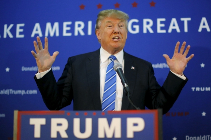 U.S. Republican presidential candidate Donald Trump answers a question during a news conference before a campaign rally in Worcester, Massachusetts, November 18, 2015.