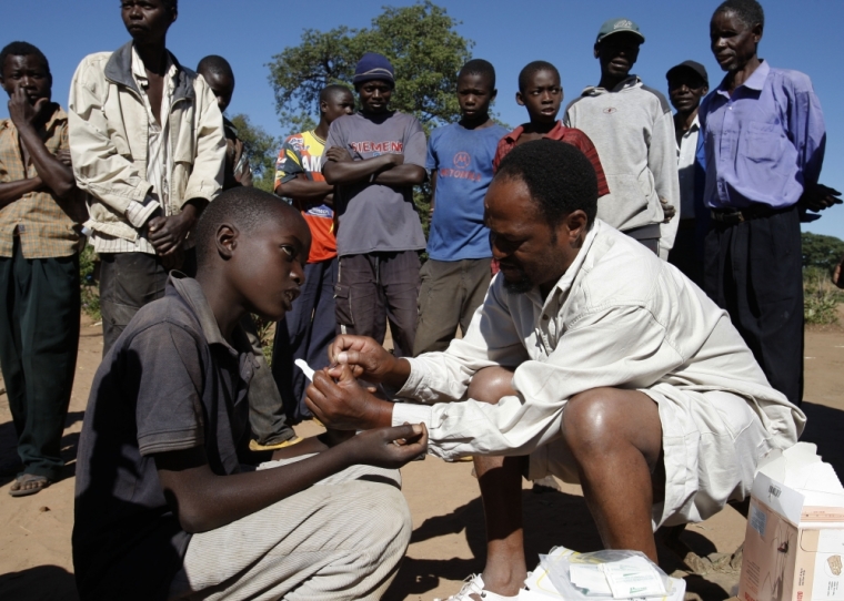 Zambian healthcare worker Laite Hanzonde performs a malaria test during the Roll Back Malaria Zambezi Expedition in Matongo village, about 60 km (37 miles) from Livingstone, April 23, 2008. Zambia will host the World Malaria Day in the presence of Belgium's Princess Astrid, Goodwill Ambassador of the Roll Back Malaria Partnership on April 25. The medical teams of the expedition will travel more than 2,500 km (1,553 miles) in inflatable boats through Angola, Namibia, Botswana, Zambia, Zimbabwe to deliver mosquito nets and medications to remote areas.