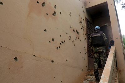 A Malian gendarme climbs stairs at the Byblos hotel, site of a siege over the weekend in which 17 people died in Sevare, Mali, August 11, 2015. 