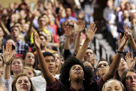 Jannine Faulkner sings during a worship service before U.S. Democratic presidential candidate Sen. Bernie Sanders, I-Vt., delivers an address to Liberty University students at the school in Lynchburg, Virginia, September 14, 2015.