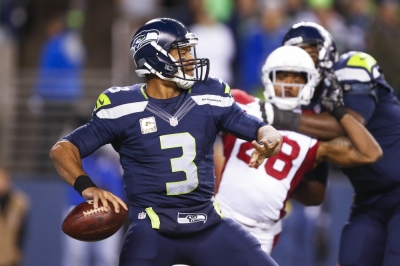 Seattle Seahawks quarterback ; Wilson (3) looks to pass against the Arizona Cardinals during the second quarter at CenturyLink Field, Seattle, Washington, November 16, 2015.